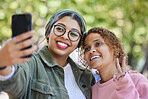 Women friends, selfie and peace sign at park with smile, hug or emoji for memory, blog or post on web. Muslim girl, gen z students and happy for profile picture, photography or icon for social media