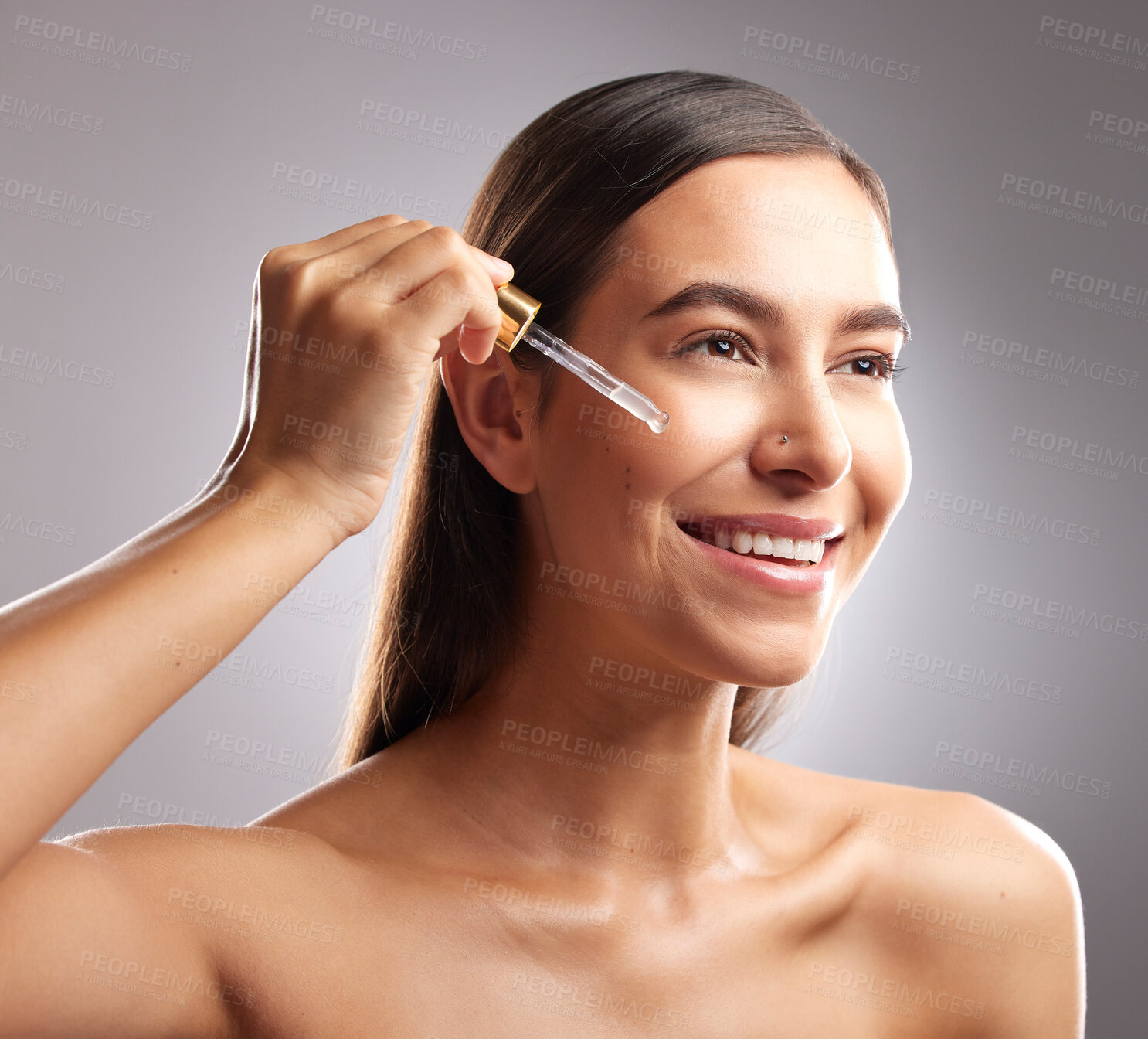 Buy stock photo Beauty, face and woman smile with serum dropper, skincare hydration product or collagen oil treatment for anti aging wellness. Liquid hyaluronic acid, dermatology and studio person on gray background
