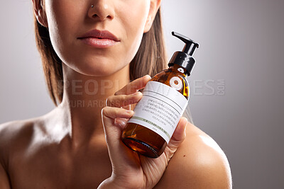 Buy stock photo Beauty, woman and cleanse wash bottle for morning bathroom routine, skin hydration glow and body cleaning wellness. Self care hygiene, liquid product label or closeup studio person on grey background