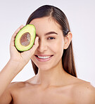 Face, skincare and happy woman with avocado for beauty isolated on a white background in studio. Portrait, smile and natural model with fruit food for nutrition, healthy diet or omega 3 for wellness