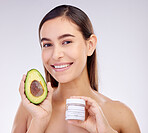 Skincare, portrait and a woman with avocado or cream on a studio background for dermatology wellness. Happy, health and a young girl or model advertising a food or detox facial product for beauty