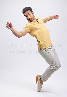 Buy stock photo Dance, movement and man on toes in studio for freedom, energy and performance. Creative, training and isolated male person balance, moving and in action pose for a dancer on mockup, white background
