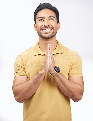 Buy stock photo Man, praying hands and studio with looking up, smile and communication with God by white background. Student, prayer and mindfulness with religion, gratitude and trust for peace, hope and meditation