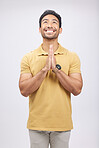 Man, prayer hands and studio with looking up, smile and communication with God by white background. Student, praying and mindfulness with religion, gratitude and worship for peace, hope or meditation