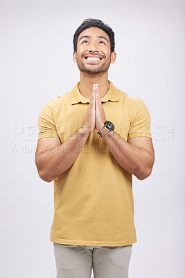 Buy stock photo Man, prayer hands and studio with looking up, smile and communication with God by white background. Student, praying and mindfulness with religion, gratitude and worship for peace, hope or meditation
