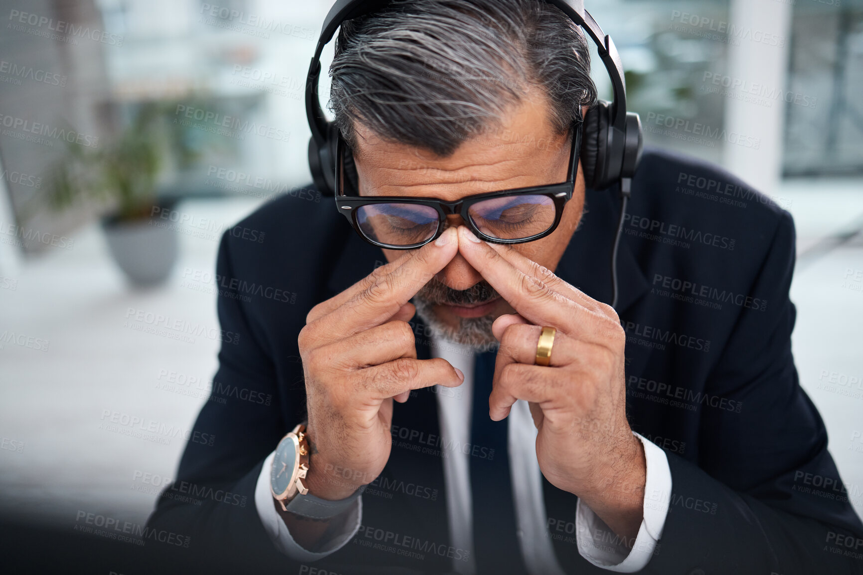 Buy stock photo Depressed, tired and man in a call center with a headache from telemarketing or technical support. Sad, fail or a mature customer service employee or boss with a mistake or anxiety with communication