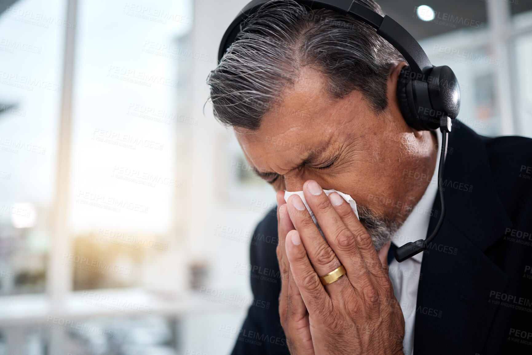 Buy stock photo Sick, man and blowing nose in call center office for flu, allergies, and health risk in telemarketing agency. Face of mature salesman, CRM agent and tissue for virus, allergy bacteria and sneeze 