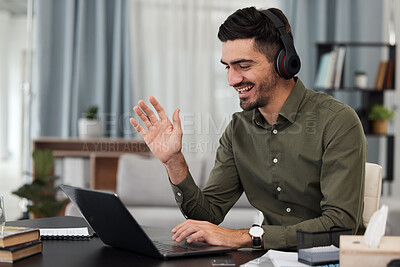 Buy stock photo Man, remote work and video call with headphones at laptop for voip communication, online meeting or telecom. Freelance virtual assistant wave at computer with microphone for consulting in home office