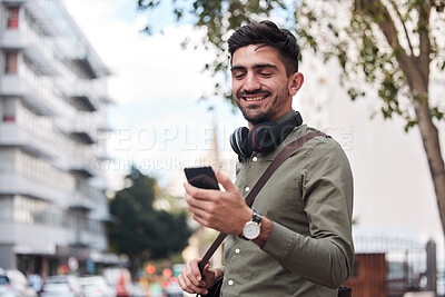Buy stock photo Travel, city and man with a phone outdoor for communication, connection or chat. Happy male student on urban street with smartphone and network for reading social media or navigation app notification