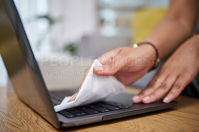 Buy stock photo Woman, hands and cleaning laptop for hygiene, disinfection or germ and bacteria removal on wooden desk. Closeup of female person, maid or cleaner wiping computer for sanitizing on table at home