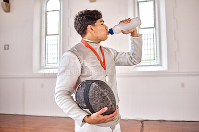 Buy stock photo Sports, fencing and man drinking water for training, fitness or workout with helmet in club. Bottle, fencer or athlete with beverage after exercise with liquid for nutrition, body health or wellness