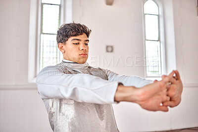 Buy stock photo Sports, fencing and man stretching for exercise, training and workout for competition in studio. Fitness, sword fighting and male person warm up arms getting ready for challenge, match and practice