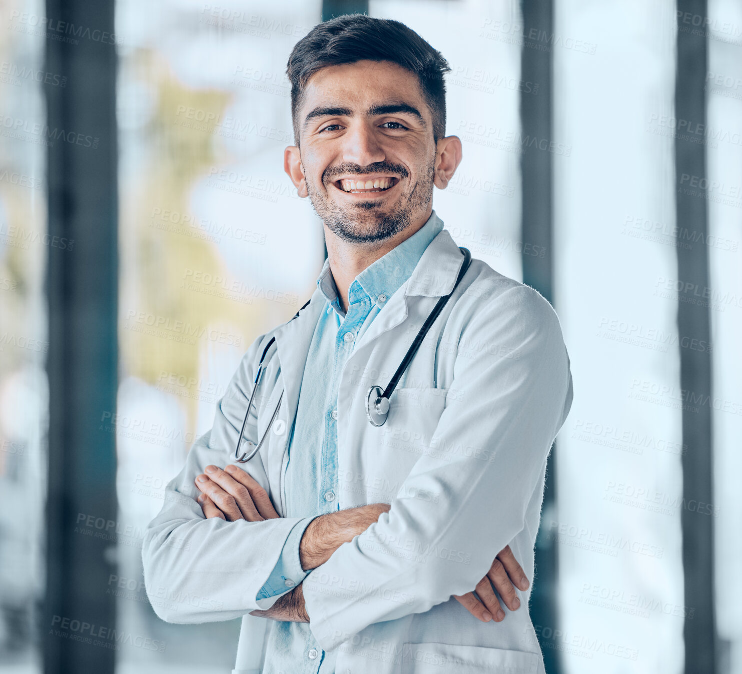 Buy stock photo Happy man, doctor and professional with arms crossed for healthcare, advice or career ambition at the hospital. Portrait of male person, surgeon or medical expert smile for healthy wellness at clinic