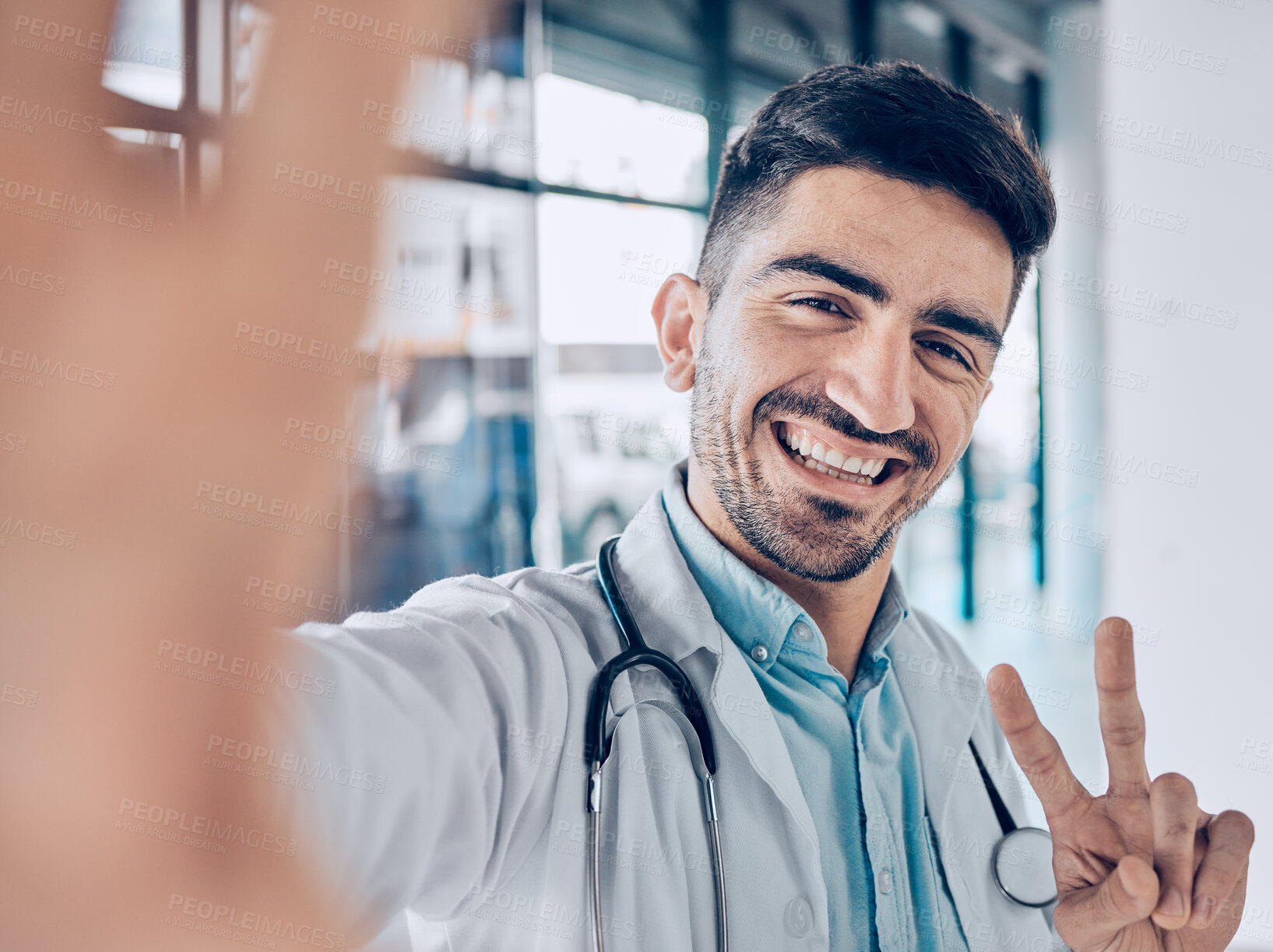 Buy stock photo Happy, selfie and man doctor peace sign for social media for healthcare, medical and hospital work. Job, male professional and surgeon worker portrait with picture and smile for internet photo