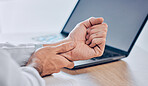 Man, hands and wrist pain from injury, accident or carpal tunnel syndrome on desk at office. Closeup of male person or employee with bad arm ache, sore muscle or tension and overworked at workplace