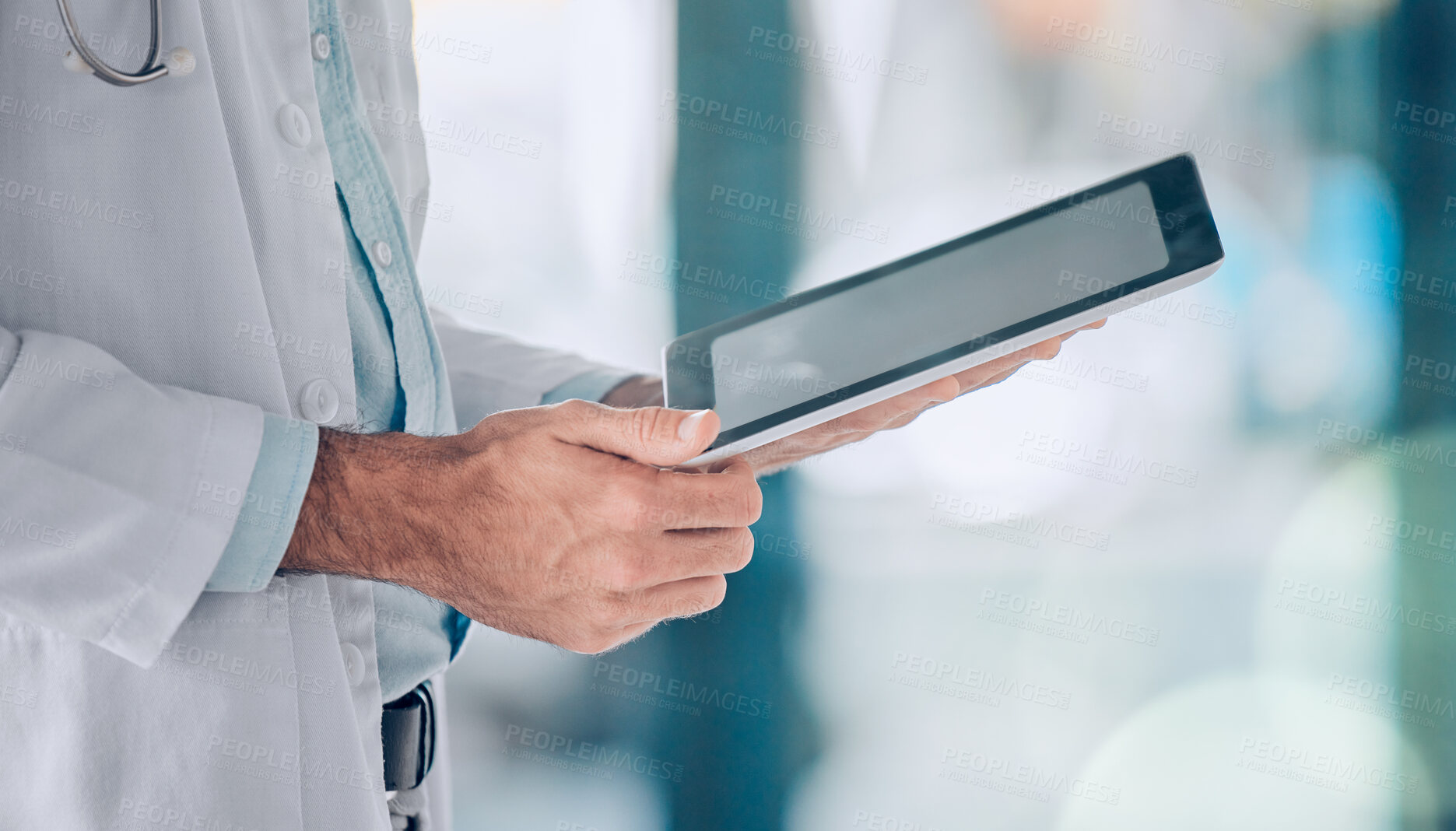Buy stock photo Digital tablet, hands and man doctor in hospital typing, planning and online consulting on blurred background. Clinic, schedule and male heath expert on app for telehealth, help or research advice