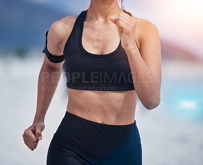 Buy stock photo Running, body and woman at a beach for fitness, training and performance, health and workout on blurred background. Sports, wellness and female runner at sea for resilience, challenge or ocean run