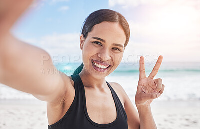 Buy stock photo Exercise, selfie and woman at beach with peace hands for running, sports or fitness in nature. Portrait, happy and lady health and wellness influencer smile for social media, blog or profile picture