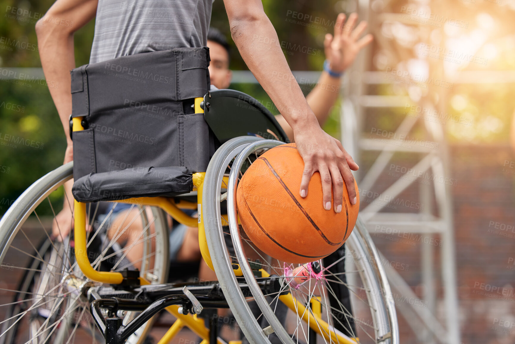 Buy stock photo Sports ball, wheelchair basketball and hands of person playing match competition, challenge or attack on outdoor court. Player, commitment and back of athlete with disability, training and exercise
