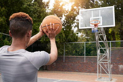 Buy stock photo Man, basketball and net outdoor to score points, winning and aim for target from the back. Player, court and athlete prepare to throw ball in hoop for fitness, sports games and competition training