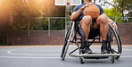 Wheelchair, basketball and man with sports ball at outdoor court for fitness, training and cardio. Exercise, hobby and male with disability at a park for game, workout and weekend fun or active match