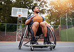 Sports, wheelchair and man with basketball at outdoor court for fitness, training and cardio. Exercise, hobby and male with disability at a park for game, workout and resilience, challenge or mindset