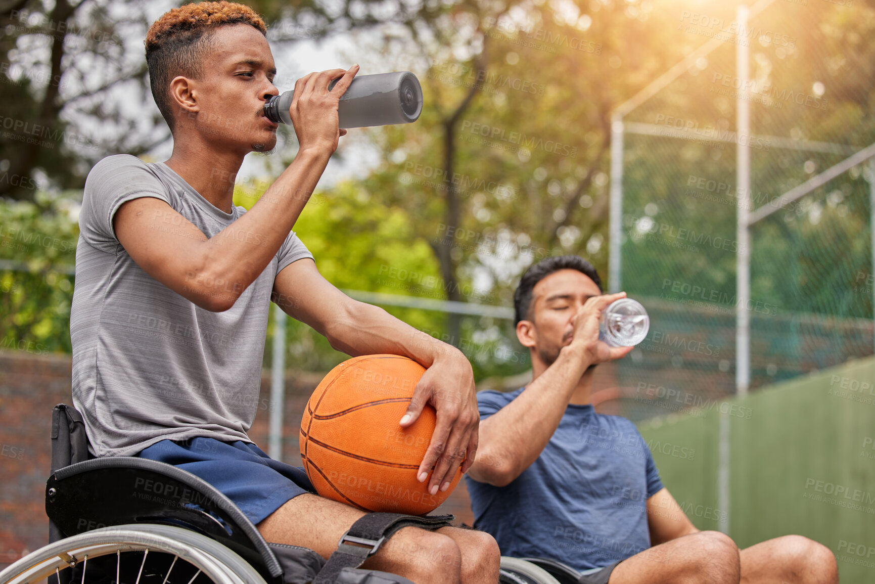 Buy stock photo Men in wheelchair, basketball players or drinking water for sports break, rest or court fitness electrolytes. People with a disability, athletes or workout friends with bottle for exercise recovery