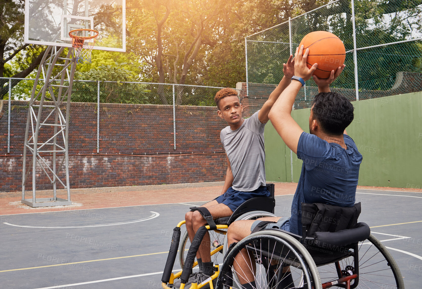 Buy stock photo Sports, wheelchair basketball and people shooting ball in match competition, challenge game or fitness practice. Player defence, shot and young athlete with disability, training and exercise on court