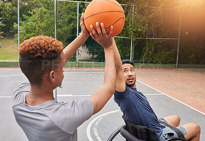 Sports, wheelchair basketball player and people shooting, defend and practice target, goal or ball aim in outdoor court competition. Focus, athlete and player workout, fitness and men with disability