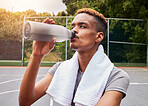 Outdoor, fitness and black man with water, training and body recovery with exercise, workout goals and tired. Healthy person, guy and athlete with liquid, hydration and thirsty on a court for sports