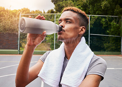 Buy stock photo Outdoor, fitness and man with water, training or body recovery with exercise, workout goal or tired. Healthy person, exhausted or African athlete with liquid, hydration or thirsty on court for sports