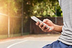 Smartphone in hand, person outdoor and typing, social media scroll and communication with mobile app. Using phone while at sports playground, texting and online chat with contact and technology