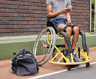 Buy stock photo Sports, wheelchair basketball and a man with a disability on a court for fitness, training or competition. Phone, legs and exercise with a male athlete outdoor for a workout as a game player