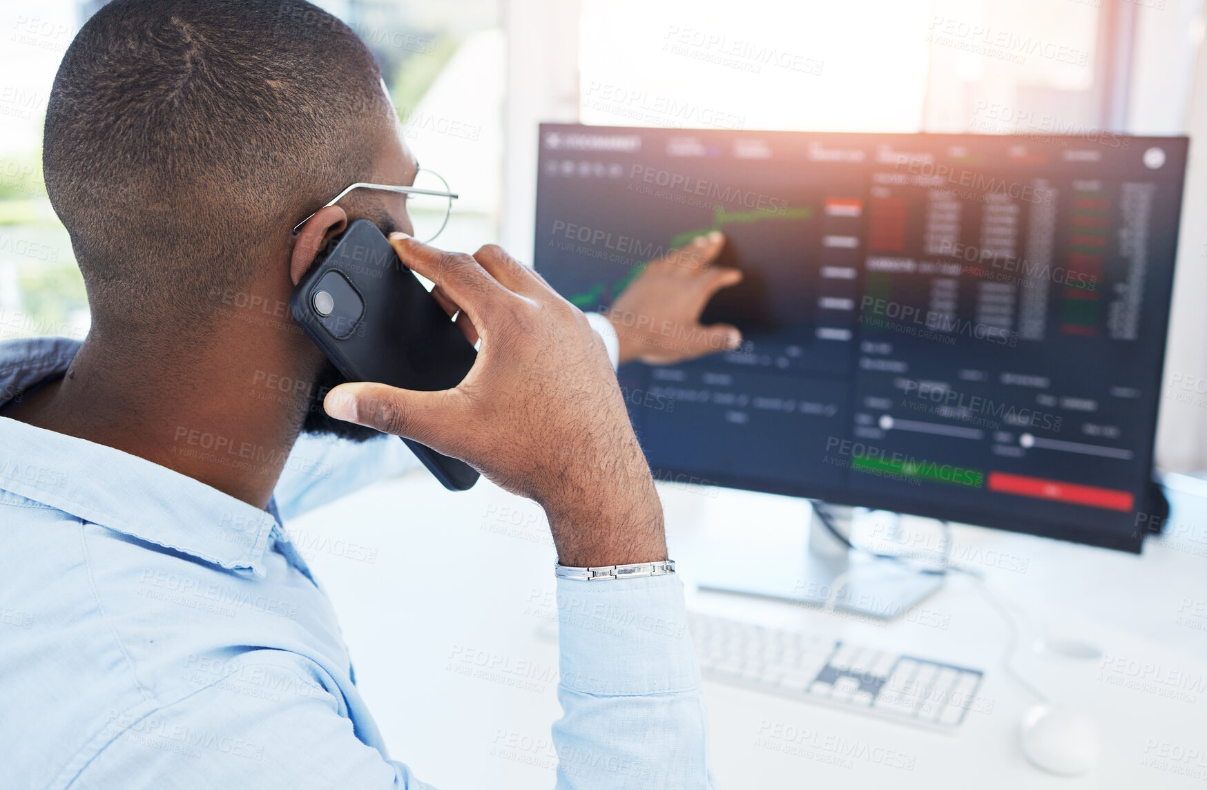 Buy stock photo Trading, computer and phone call with black man in office for stock market, finance and growth. Investment, cryptocurrency and data with male employee for digital, technology and profit analysis