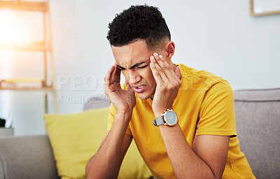 Buy stock photo Headache, stress and tired with man on sofa for pain, burnout and student. Fatigue, mental health and frustrated with face of male person in living room at home for anxiety, exhausted and migraine