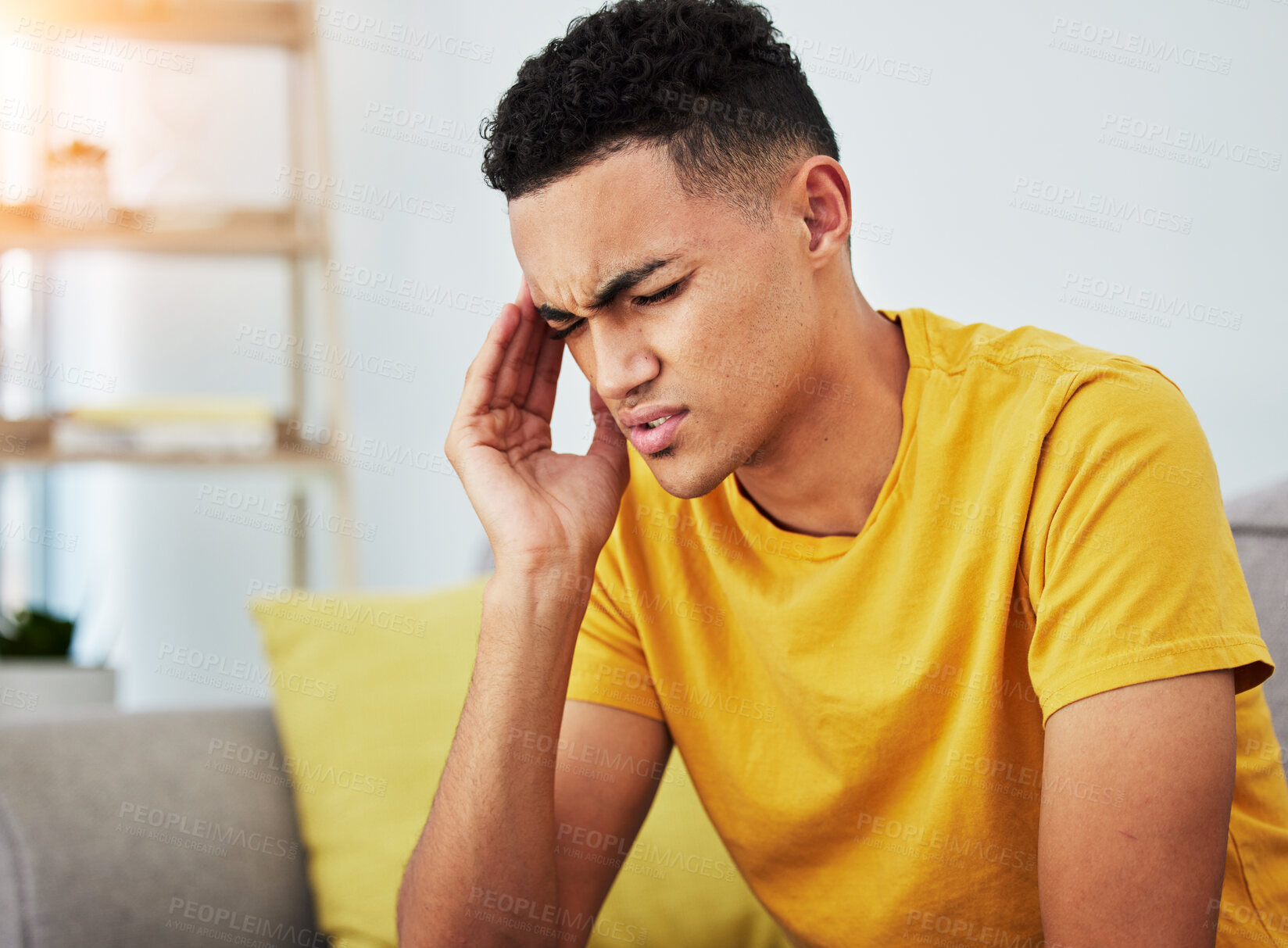 Buy stock photo Headache, stress and student with man on sofa for pain, burnout and tired. Fatigue, mental health and frustrated with face of male person in living room at home for anxiety, exhausted and migraine