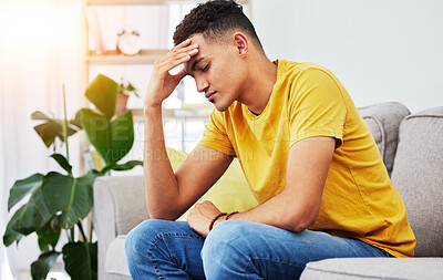 Buy stock photo Tired, stress and student with man on sofa for pain, burnout and headache. Fatigue, mental health and frustrated with male person thinking in living room at home for anxiety, exhausted and migraine