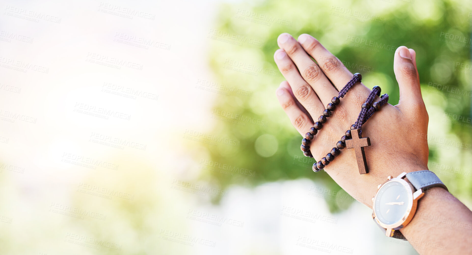 Buy stock photo Faith, hands praying and rosary in garden with mockup, praise and religion with holy mindset. Christian prayer beads, cross and person in worship in nature with hope, spiritual gratitude and space.