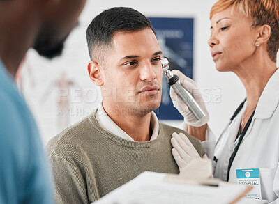 Buy stock photo Doctor, nurse and patient, ear test and healthcare with people in hospital, check vitals and ENT specialist. Medical exam, men and woman in clinic, hearing problem with tools and health consultation