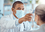 Doctor in face mask, patient and thermometer in office for covid test, safety and healthcare in hospital consultation. Temperature check, corona and woman at clinic with medical professional for exam