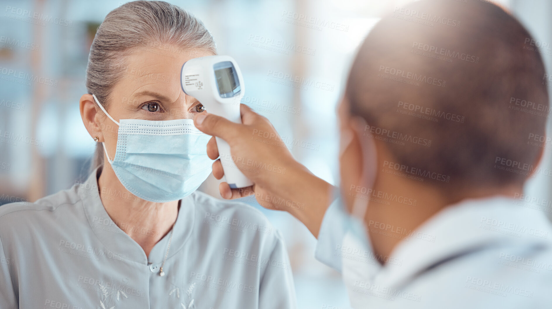 Buy stock photo Woman in face mask, doctor and thermometer in office for covid test, safety and healthcare in hospital consultation. Temperature check, corona and patient at clinic with medical professional for exam