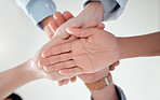 Hands, teamwork or doctors in huddle with solidarity in collaboration for healthcare goals together. Hospital closeup, people or low angle of medical nurses with group support, motivation or mission