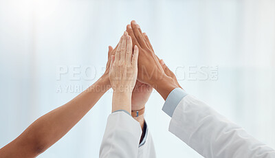 Buy stock photo Closeup, doctors and nurses in hospital high five hands for team building success, motivation or healthcare support. Diversity, medical and people in achievement, collaboration and winner celebration