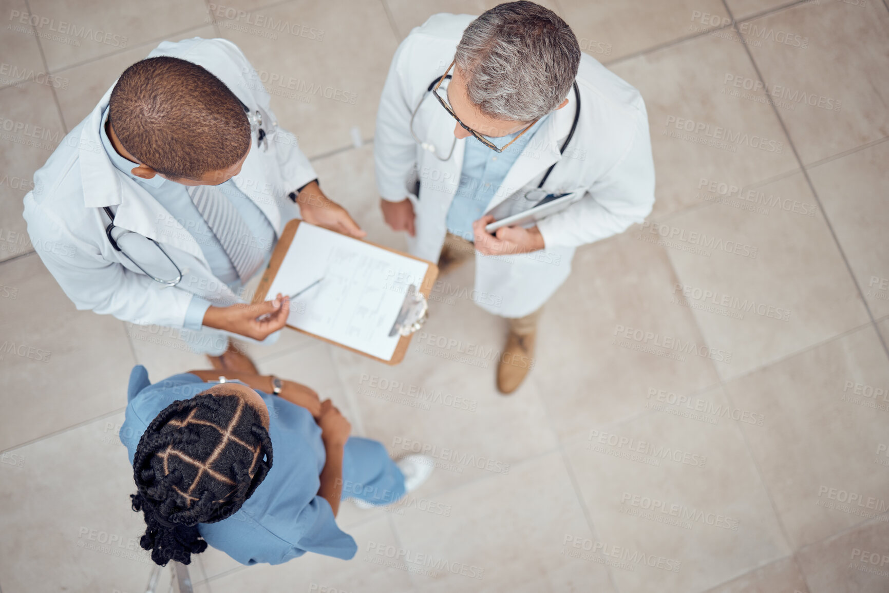 Buy stock photo Doctors, nurse and checklist in hospital from above, meeting and planning surgery or team schedule. Healthcare, discussion and medical staff with clipboard, feedback and talking together in clinic.