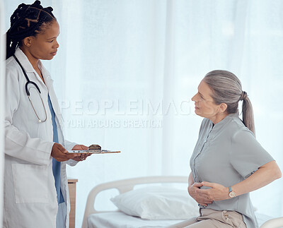 Buy stock photo Medical, consultation and doctor with mature patient in discussion on chest pain problem. Professional, clipboard and female healthcare worker talking to elderly woman with heart sickness in hospital