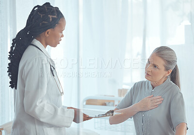 Buy stock photo Healthcare, discussion and doctor with elderly patient talking about chest pain problem. Consultation, clipboard and female medical worker speaking to senior woman with heart sickness in the hospital