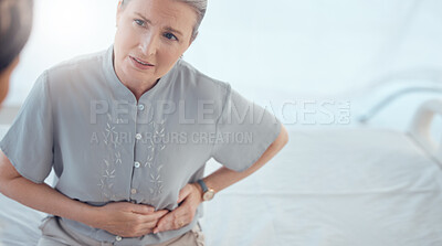 Buy stock photo Healthcare, senior and woman with a doctor and pain from the appendix for a consultation. Stomach pain, hospital and elderly clinic patient speaking to medical professional about an injury or problem