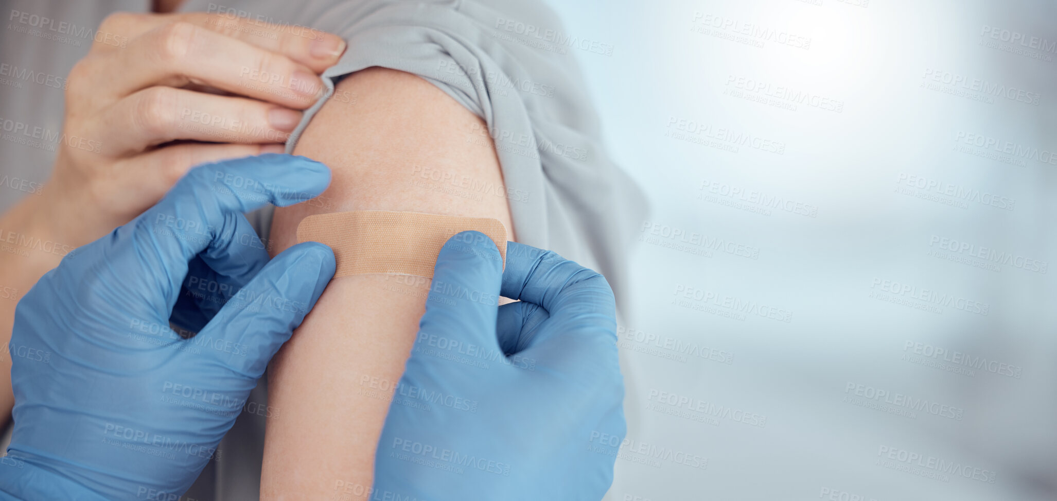 Buy stock photo Doctor, arm and plaster on patient for vaccine in healthcare clinic, virus protection and wellness services. Closeup hands of nurse with medical bandage for safety, risk or immunity with mockup space