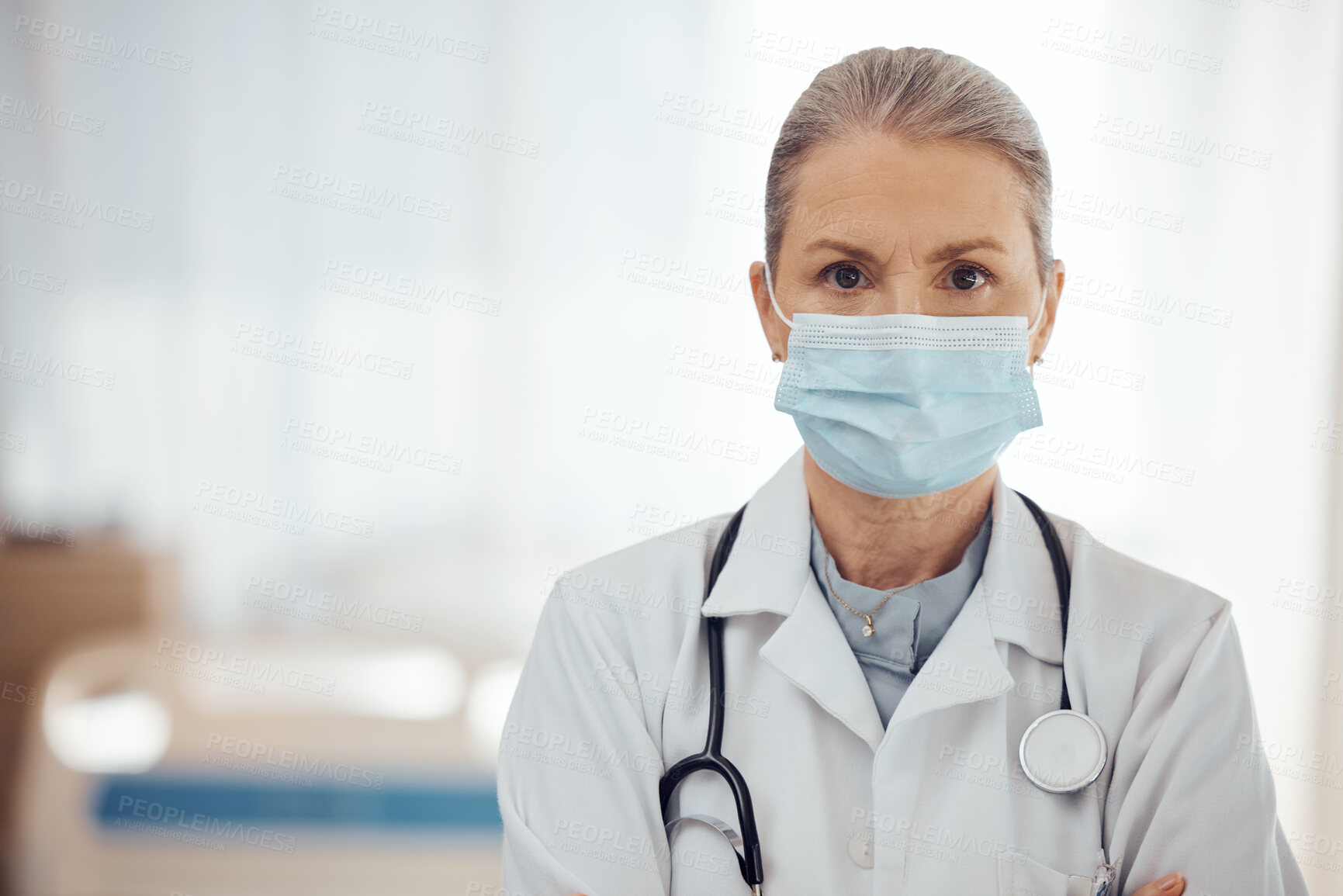 Buy stock photo Woman, portrait and doctor with face mask in hospital for medical services, surgery and mockup space. Serious female surgeon, senior therapist and healthcare manager with safety ppe working in clinic