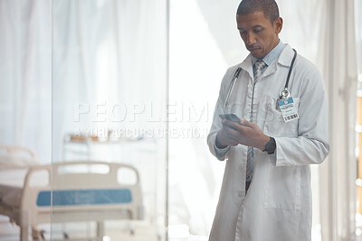 Buy stock photo Man, doctor and phone in hospital for medicine research, healthcare and prescription email in telehealth consulting. Serious, biracial person and medical worker on mobile technology for clinic help